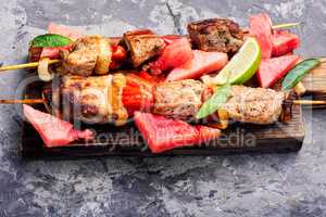 Shish kebab with watermelon garnish