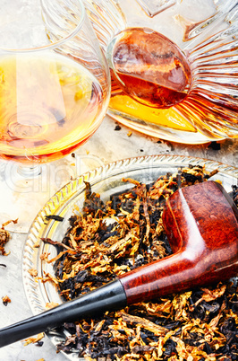 Cognac and pipe with tobacco