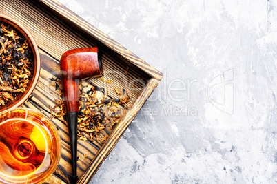 Cognac and pipe with tobacco