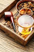 Cognac and pipe with tobacco