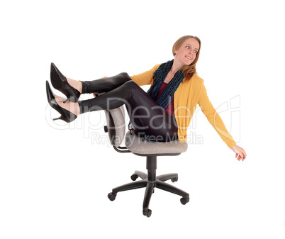 Happy woman sitting on a office chair