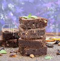 stack of baked square pieces of brownie pie