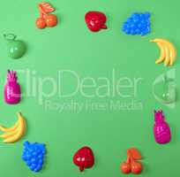green background with childrens colorful toys