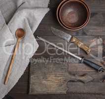 empty old brown wooden cutting board and knife