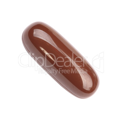 one brown gelatine pill isolated on white backgroung