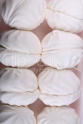 many white marshmallow on pink background at dry day