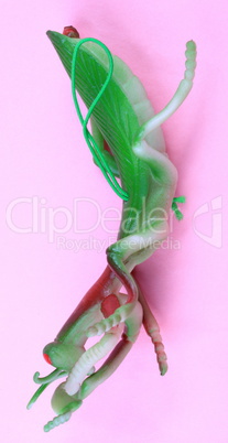 mantis toy on pink background at day