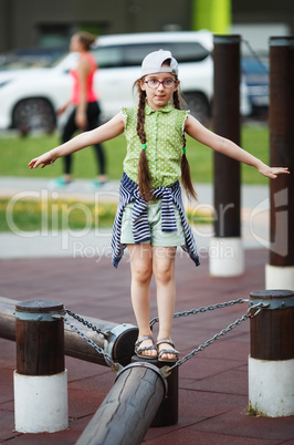 Child girl balancing