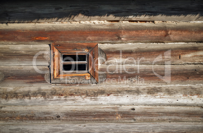 Small window, log wall