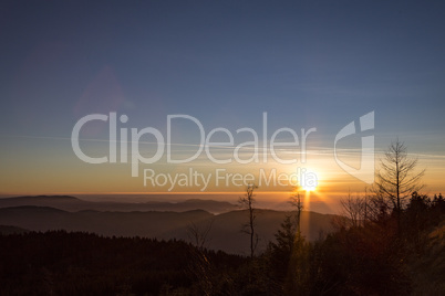 Sunset over Black Forest with blue sky