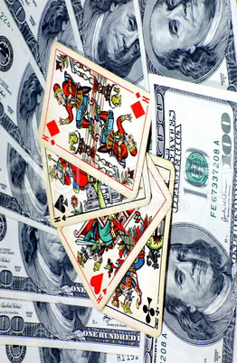 american dollars with playing cards