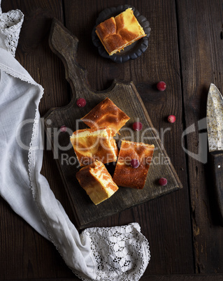 baked square pieces of pumpkin cheesecake