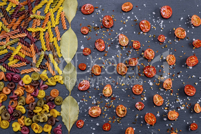 unprepared multi-colored pasta spiral made from wheat flour and