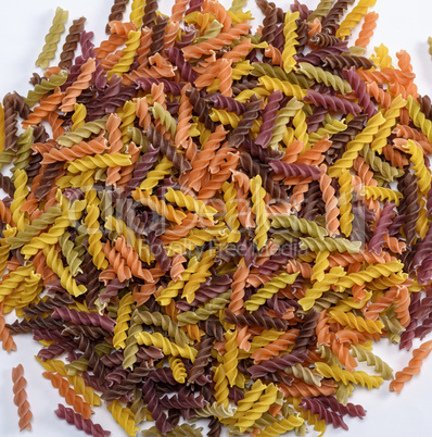 uncooked pasta colorful spiral fusilli