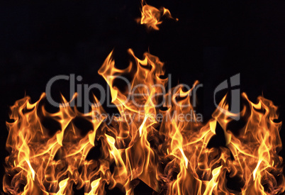 burning orange flame on black background