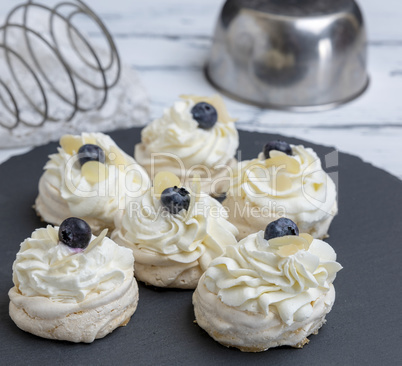 baked round meringues with whipped cream
