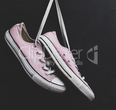 pair of textile pink sneakers