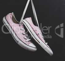 pair of textile pink sneakers