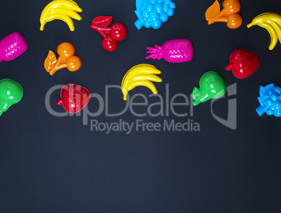 black background with childrens colorful toys
