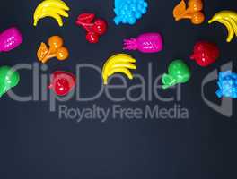 black background with childrens colorful toys