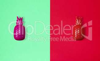 abstract paper background with plastic toy pineapple
