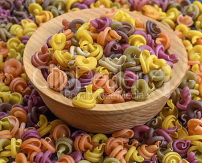 multicolored spiral raw pasta fusilli