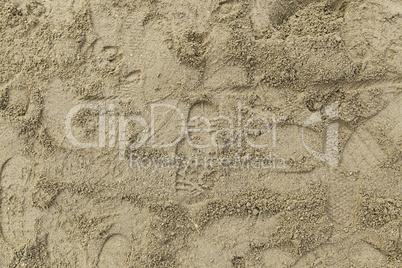 Footprints of sneakers in the sand