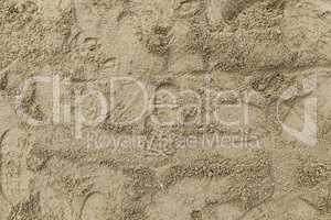 Footprints of sneakers in the sand