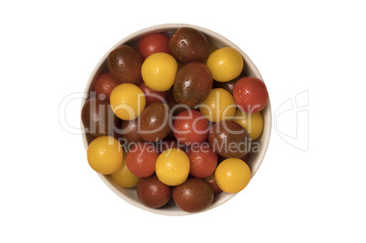 Cherry tomatoes, red,yellow and kamato in ceramic bowl on white