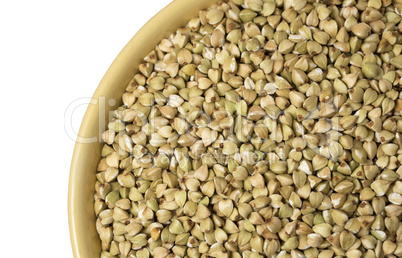 Natural fresh green buckwheat in ceramic bowl on white backgroun