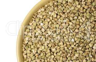 Natural fresh green buckwheat in ceramic bowl on white backgroun