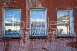 old window in vintage look with mirrored houses