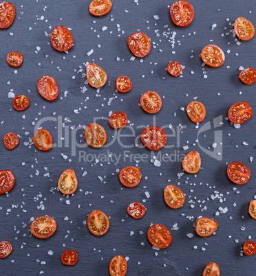 half a ripe red cherry tomato sprinkled with salt
