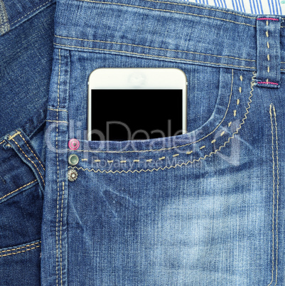 smartphone with a blank black screen is in the front pocket of
