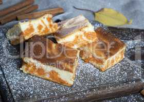 baked square pieces of pumpkin cheesecake