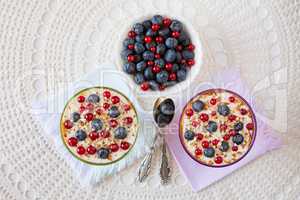 Two yogurt dessert with berries and almonds