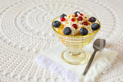 Dessert with berries and cream