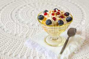 Dessert with berries and cream