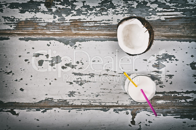 Coconut milk and half coconut seen from above