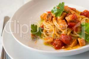 Spaghetti with fish and little tomatoes