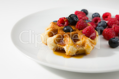 Waffles with fresh ripe berries