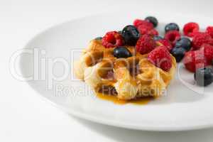 Waffles with fresh ripe berries