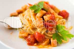 Spaghetti with fish little tomatoes and parsley