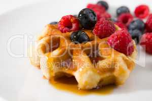 Close-up of waffles with fresh ripe berries