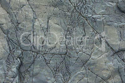 Natural stone background with cracks.