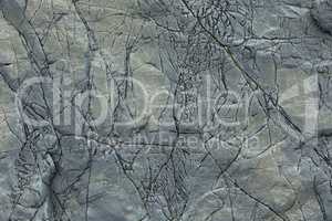 Natural stone background with cracks.