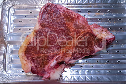 Raw T-bone steak