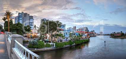 Christmas lights glow at Sunset over the colorful shops of the V