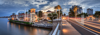 Christmas lights glow at Sunset over the colorful shops of the V