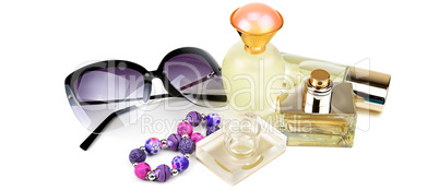 Perfume bottles, sunglasses and bracelet isolated on white backg